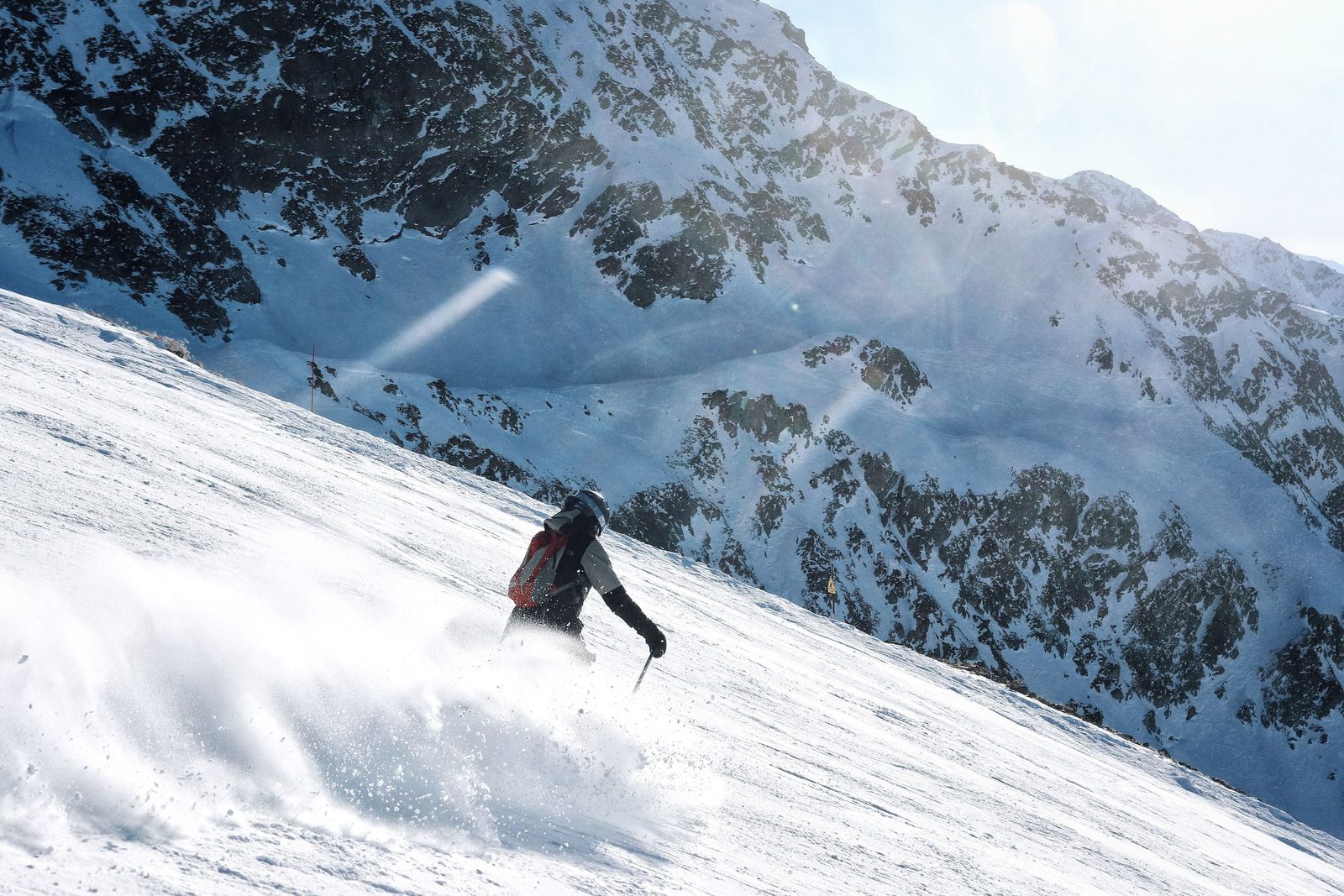 Cold Start Sled & Ski. A skier alone on a snowfield.