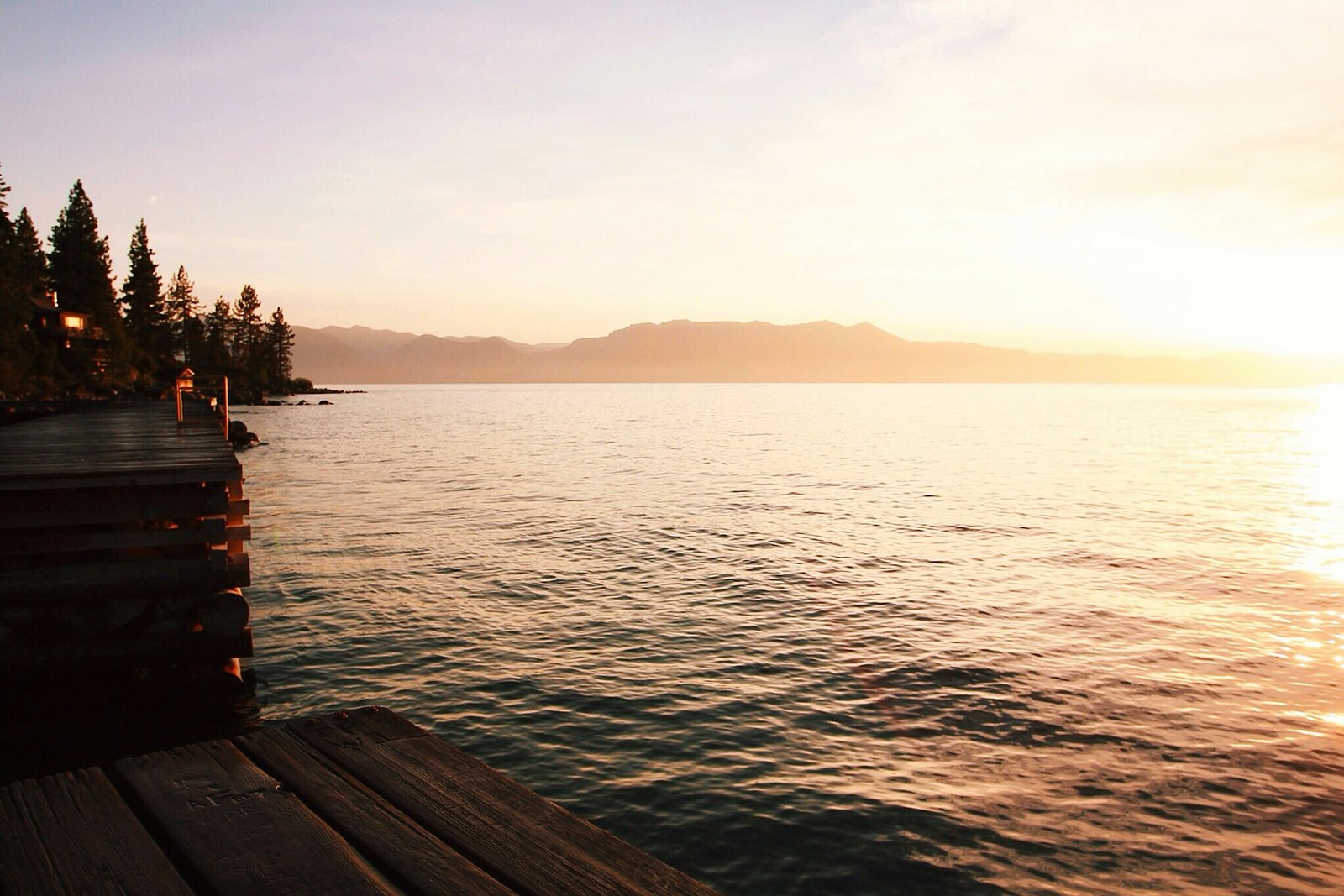 Lakeside Vows. Wooden dock at golden hour on a still lake.