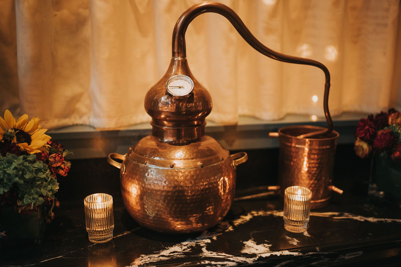Low Wines Distilling. A copper still beside the tasting bar.