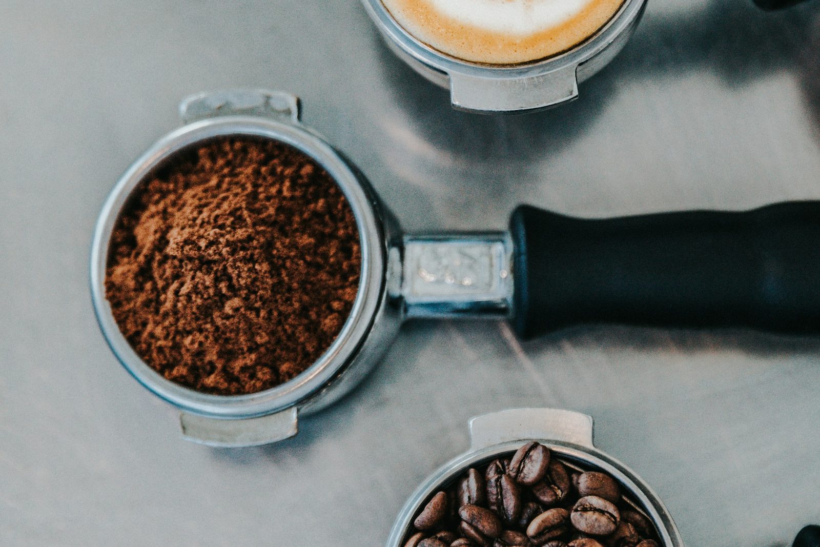 Coffee beans in a scoop. First Crack.