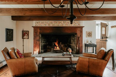 Option E thumbnail: leather chairs by roaring fireplace