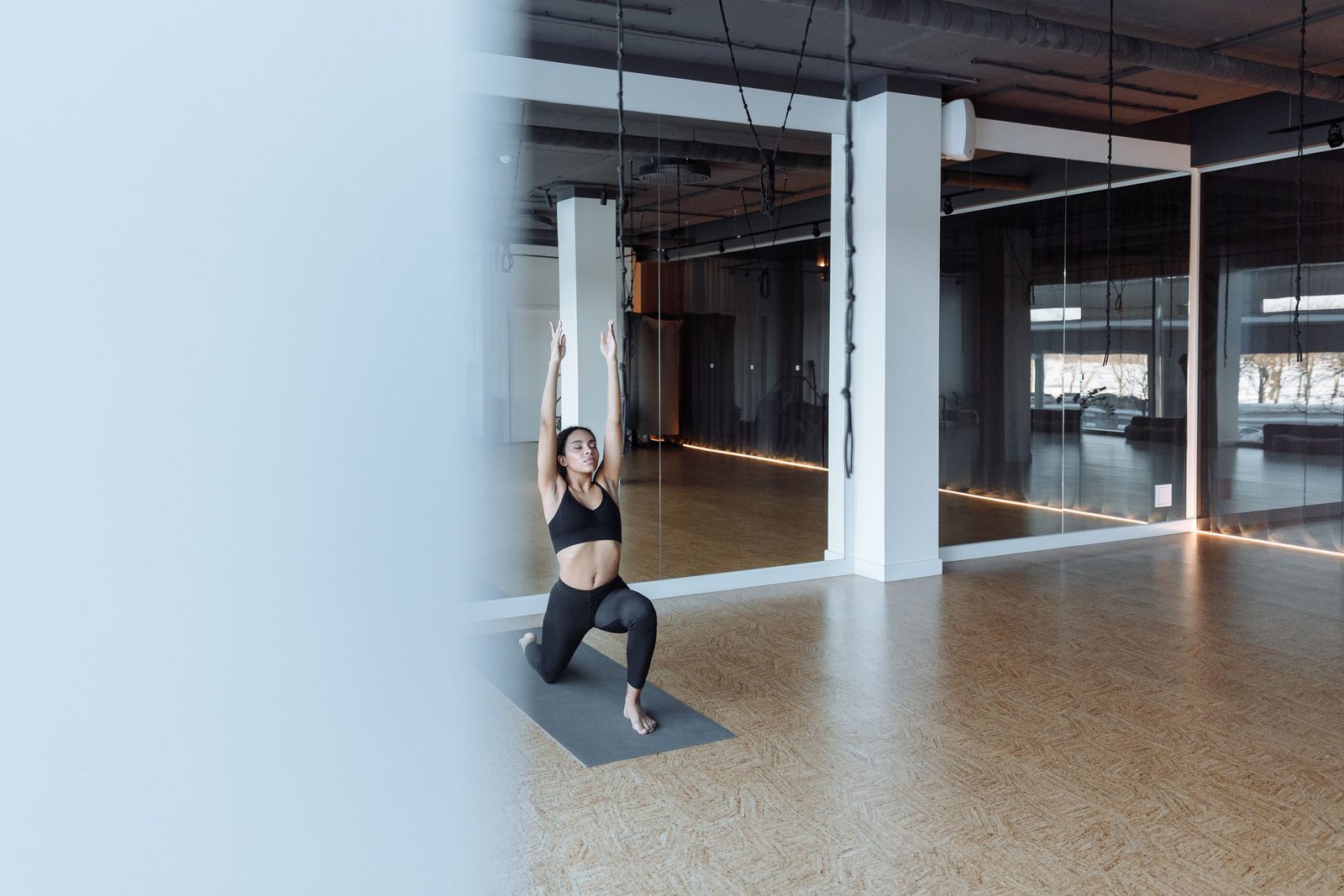A person in a yoga pose. Quiet Mat.