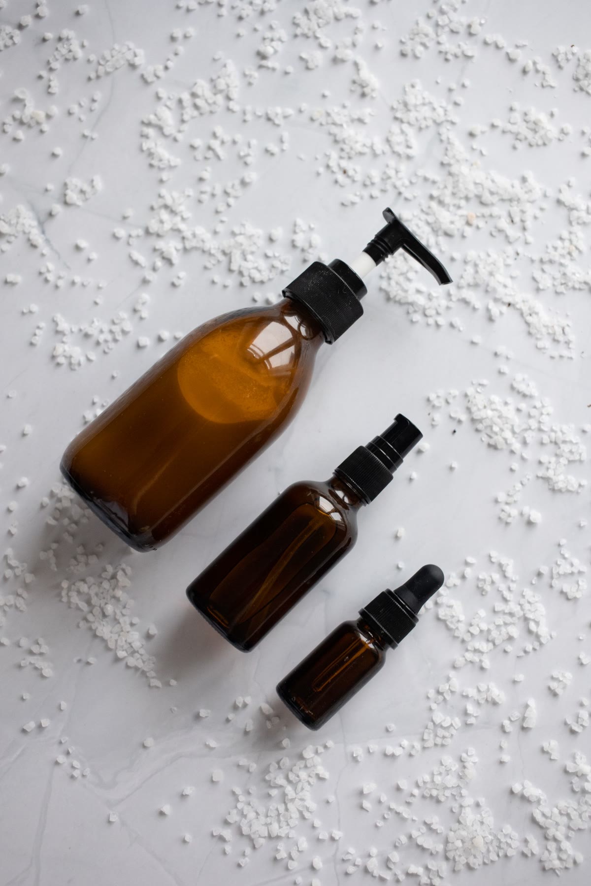 Amber care bottles on linen salt.