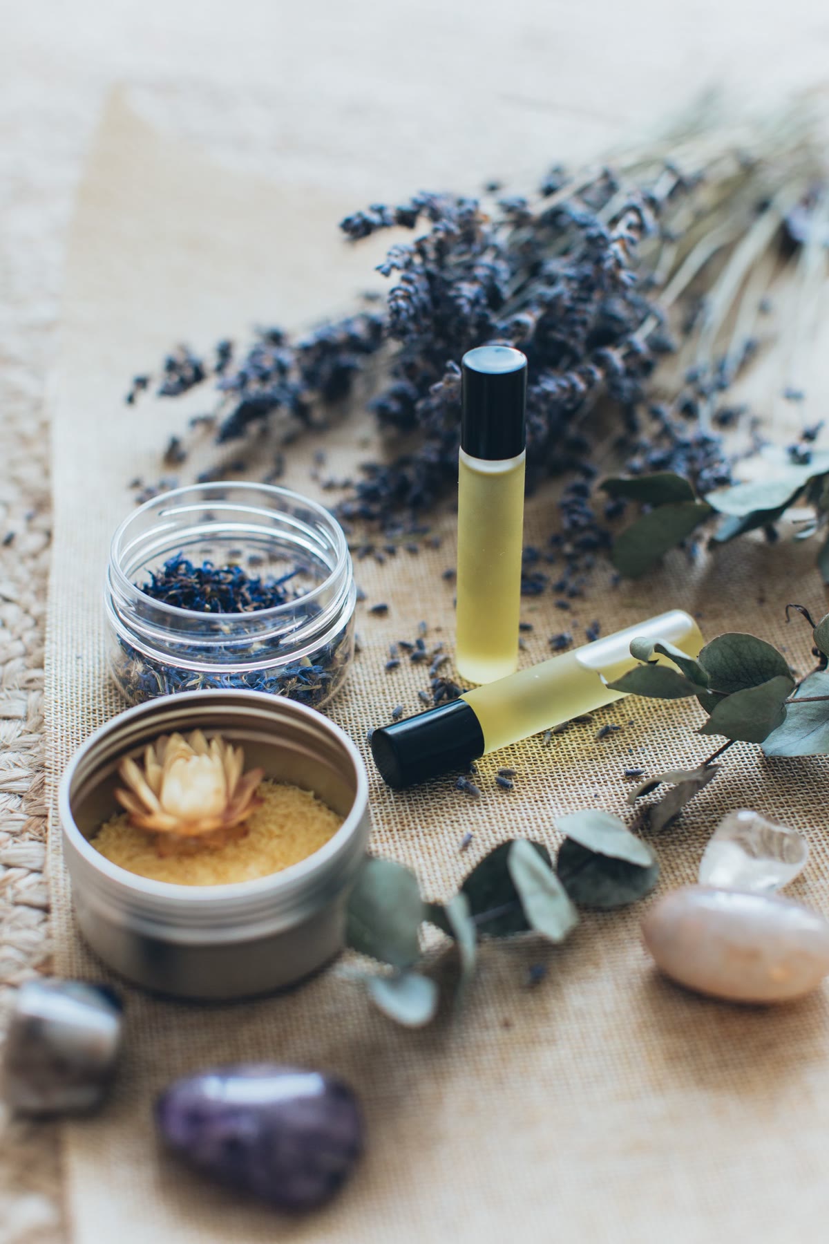 Oils and botanicals in the foreground.